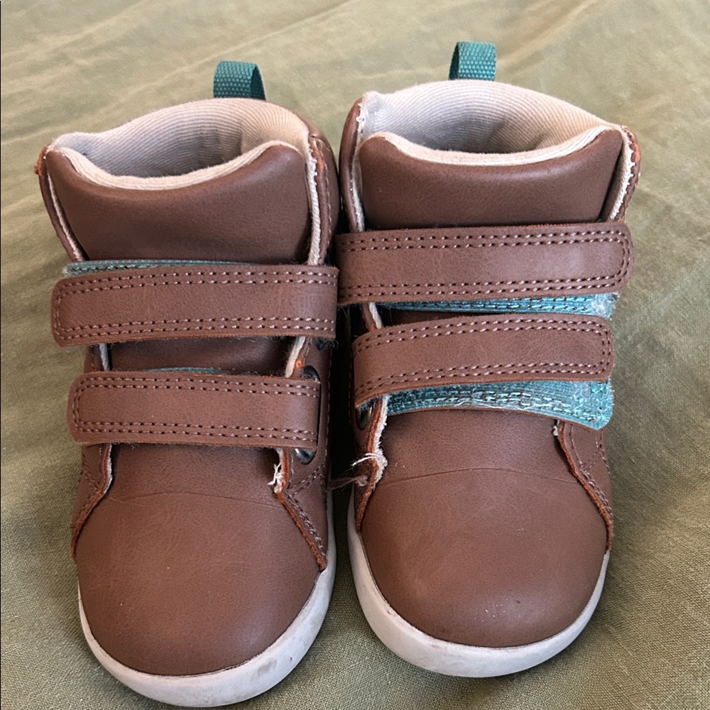 Ten Little Brown High-Top Sneakers with Teal Accent